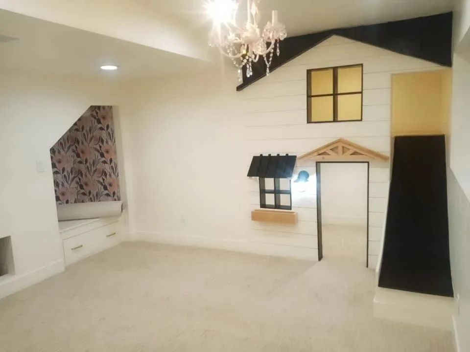 Custom built playhouse under the basement stairs